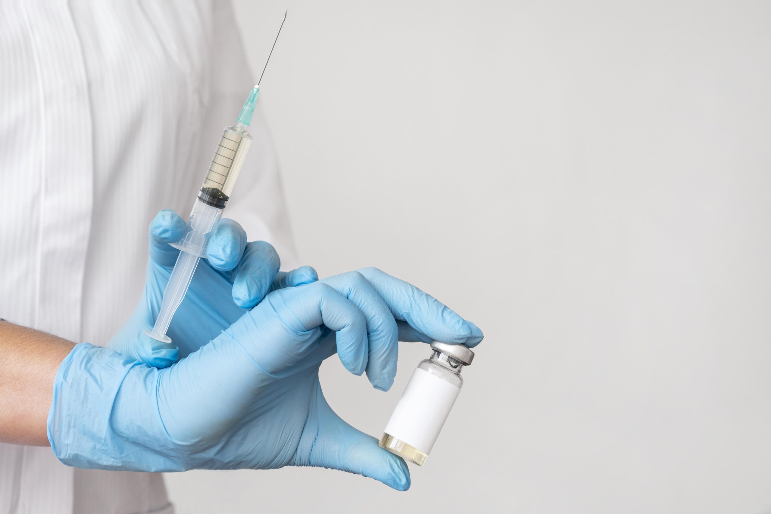 doctor-holding-syringe-with-vaccine-scaled.jpg